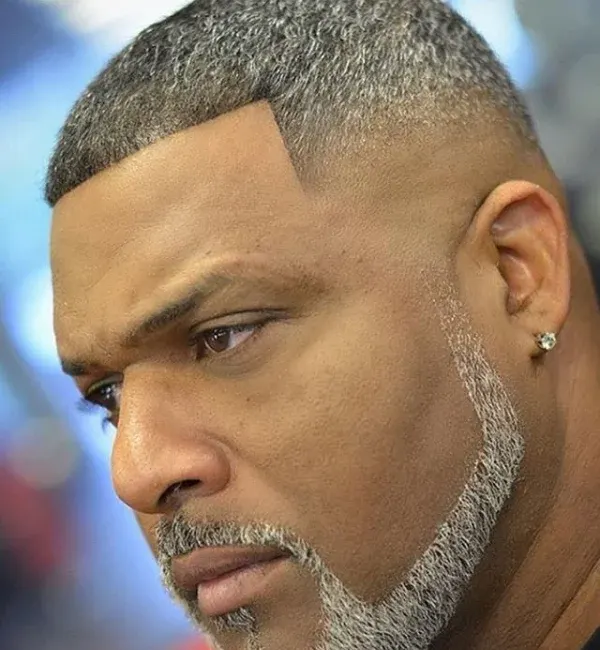Side Part Skin Fade with Thick Hard Part and Blended Beard